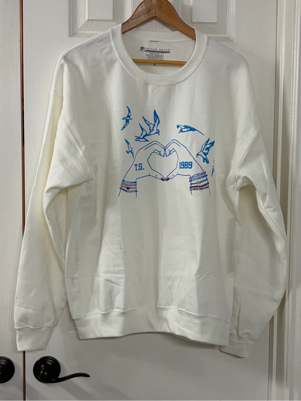 Prince Peter Collection White Crewneck Sweatshirt with Blue Graphic